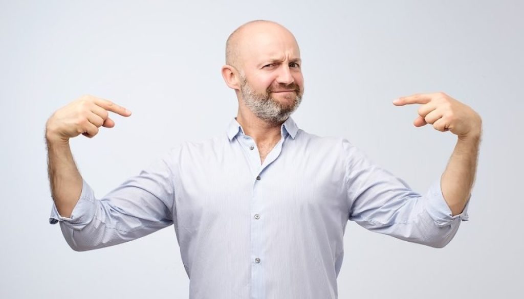 Mature,Bald,Adult,Man,With,Beard,Standing,Over,Grey,Grunge